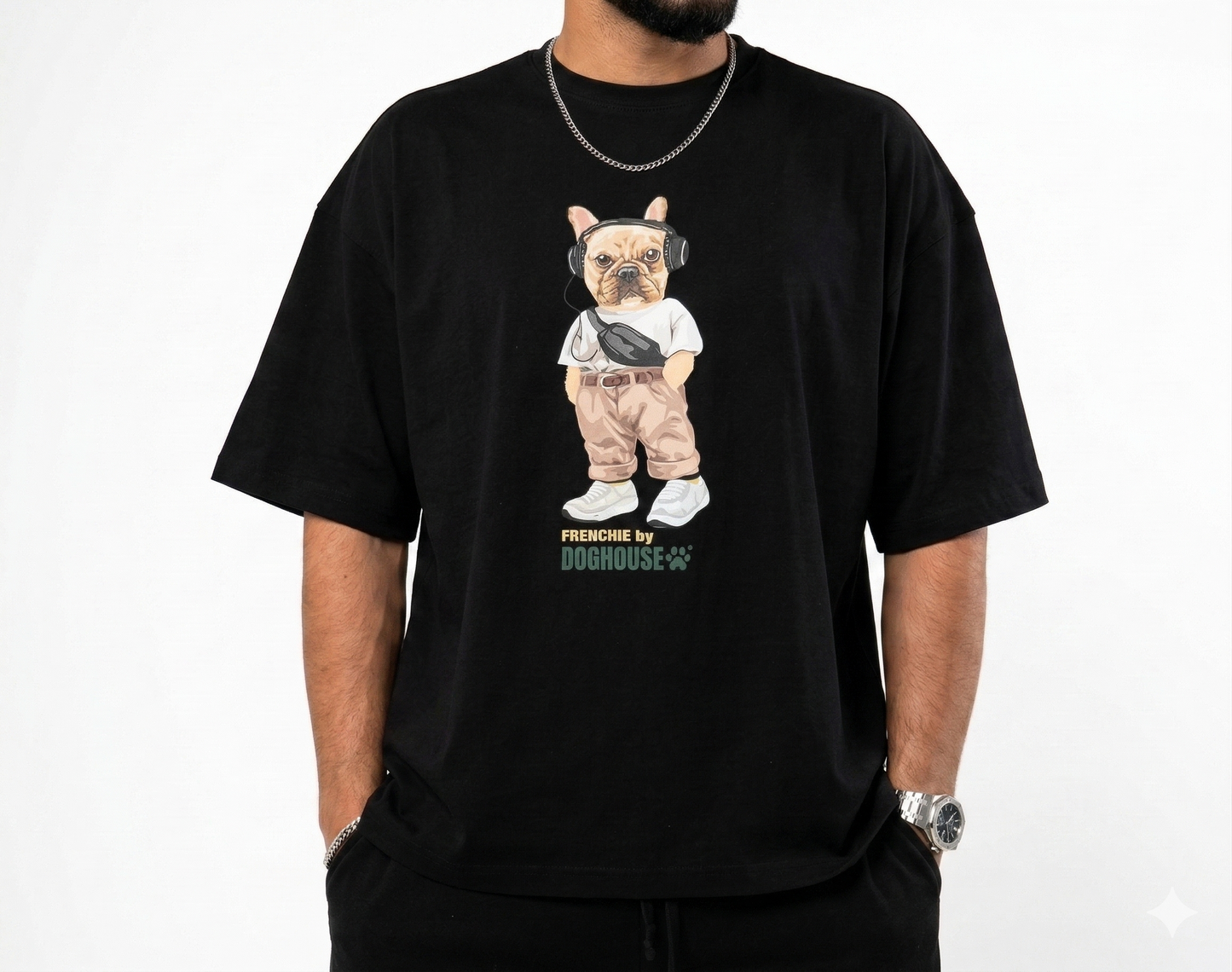 Person wearing a black t-shirt with a graphic of a dog and text on a white background